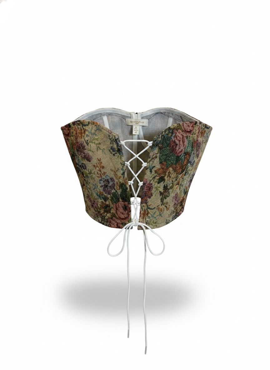 Corset de tapeçaria Lilian com detalhes decorativos, tecido resistente e acabamento elegante, ideal para moda e acessórios.
