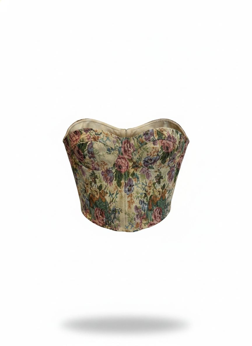 Corset tapeçaria Lilian com detalhes em tecido colorido e acabamento elaborado, apresentando um estilo elegante e artesanal.
