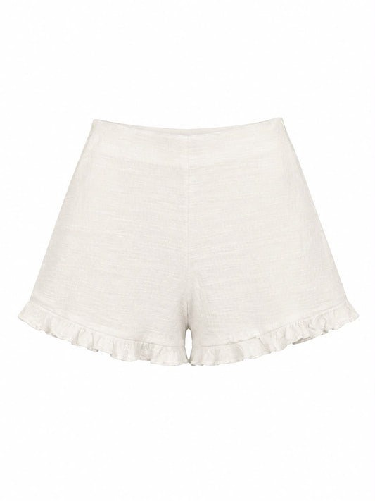 Short Tweed Verão da WLC, tecido leve e texturizado, exibido em imagem com detalhes da costura e acabamento em tom claro.