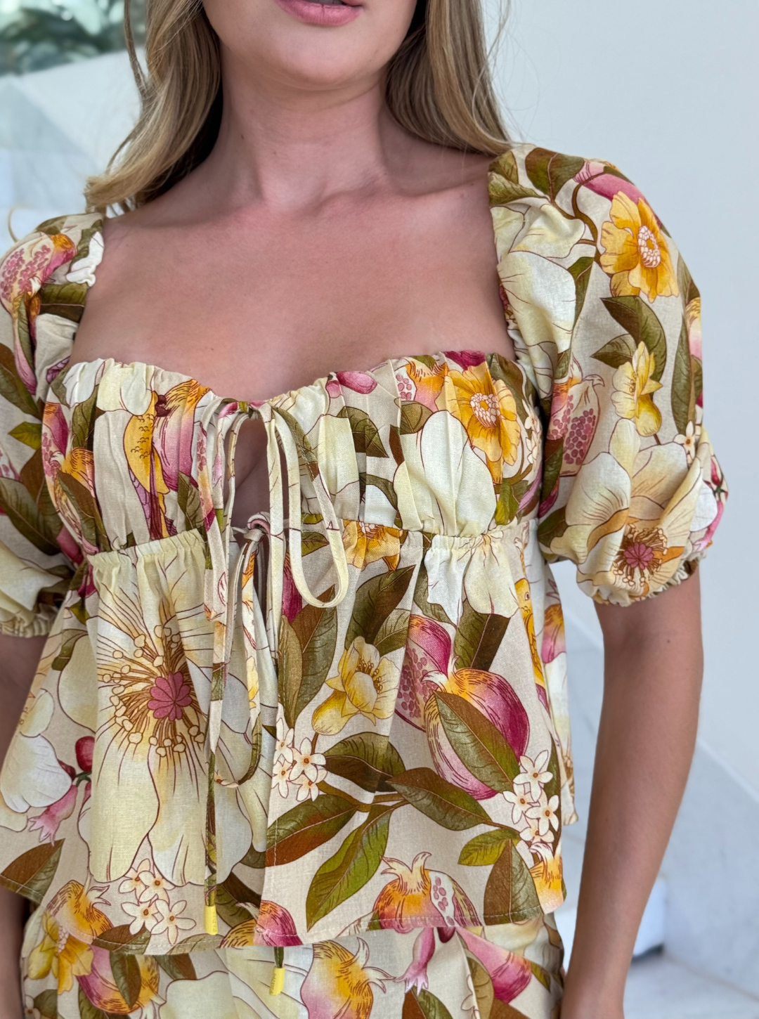 Floral print blusa by FARM, featuring vibrant colors and a relaxed fit, perfect for casual summer wear.