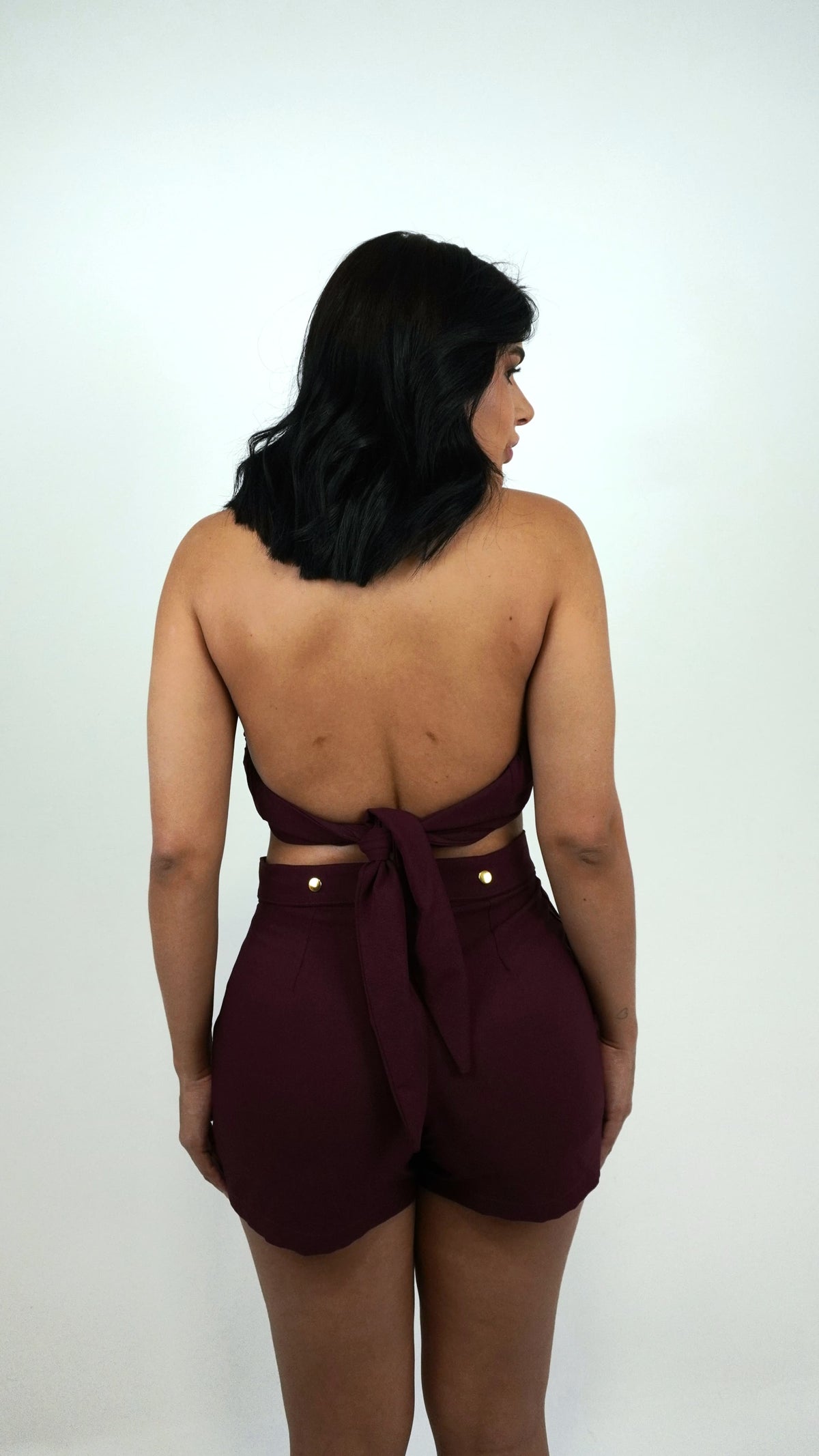 Cherry red TOP LOPZ by Wanessa Lopez Concept, showcasing vibrant color and stylish design in a modern setting.